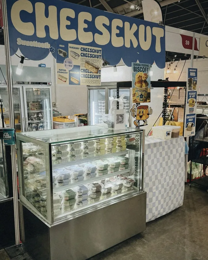 AANRS cake chiller rental Singapore, glass display stacked with dessert cups in front of two upright chillers at a bazaar booth